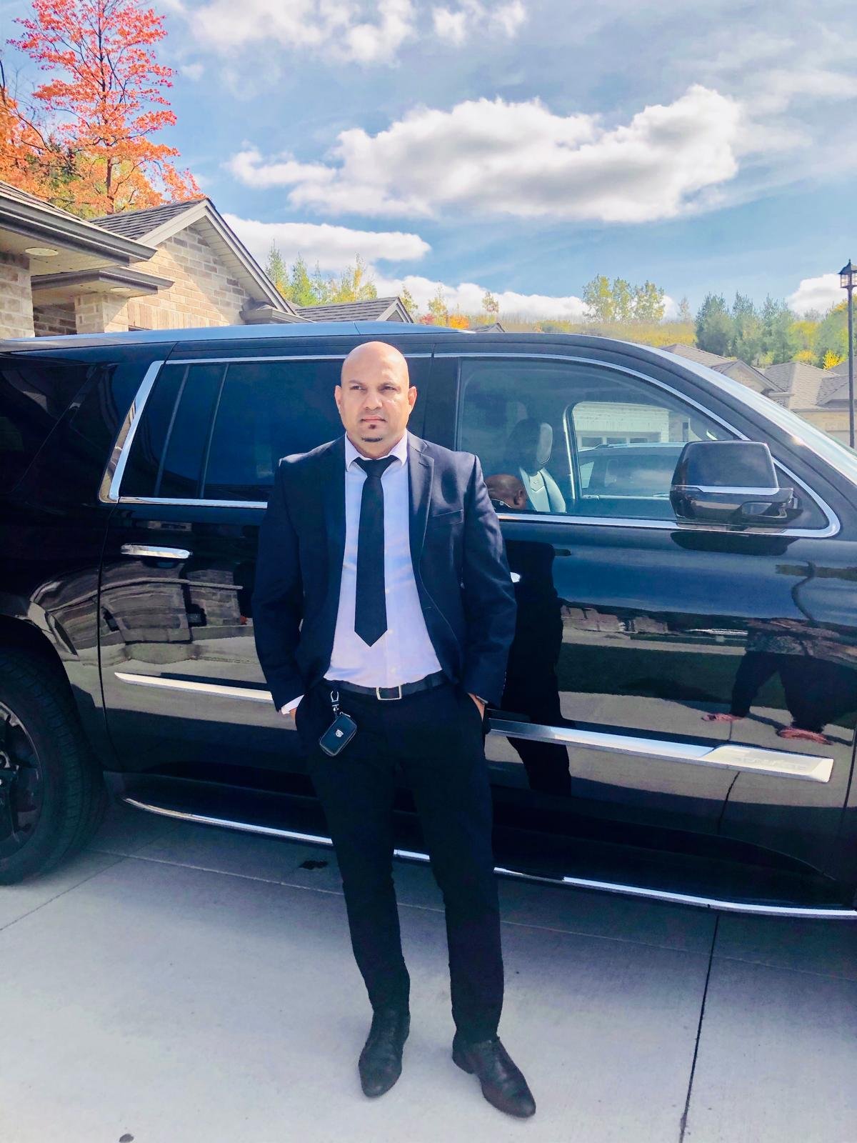 Professional luxury chauffeured black SUV limo